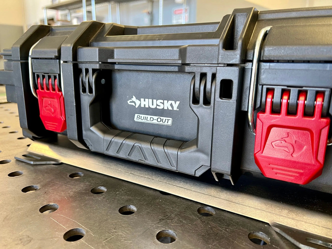 Detail of the Husky Build-Out non-locking mount for toolboxes with red base latching clips (2 of 3)