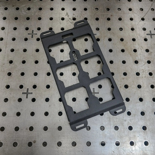black powder-coated Milwaukee Packout steel mounting plate on a professional welding table—heavy-duty 10-gauge alternative to Milwaukee 48-22-8496 for custom shop builds.