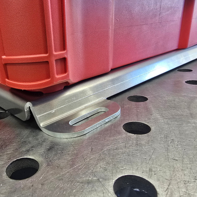 Close-up of 1/4 inch hardware mounting points on an 11-gauge aluminum Packout bracket.
