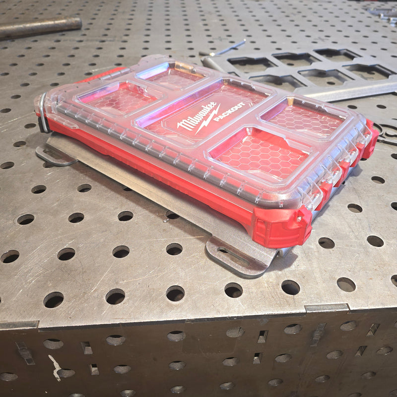 Red and clear tool organizer on metal workbench