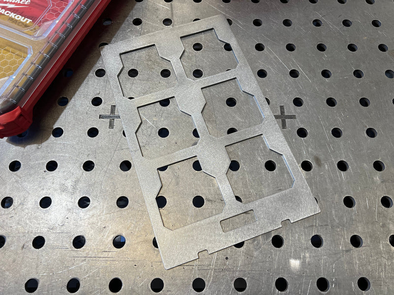 Metal cutting template on a perforated metal surface