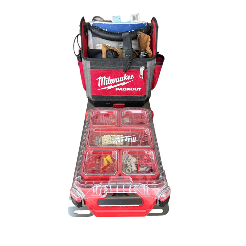 Milwaukee Packout tool bag and organizer tray set, shown open with tools inside and red storage compartments on a white background.