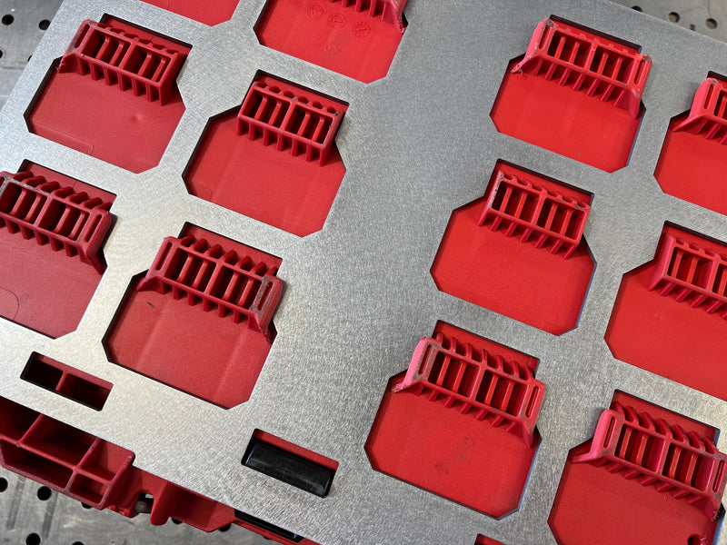 Red plastic components on a gray background