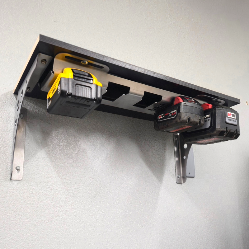 Wall-mounted tool holder with two power tools on a white wall