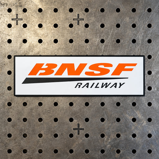 Large 24.5-inch BNSF Railway metal sign made of 14-gauge steel for train room wall art—professional orange and black heritage style.