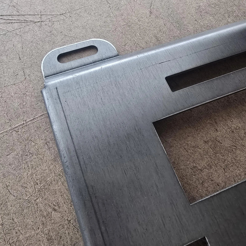 Close-up of rough hot rolled surface and bend line at top corner of raw steel Klein plate