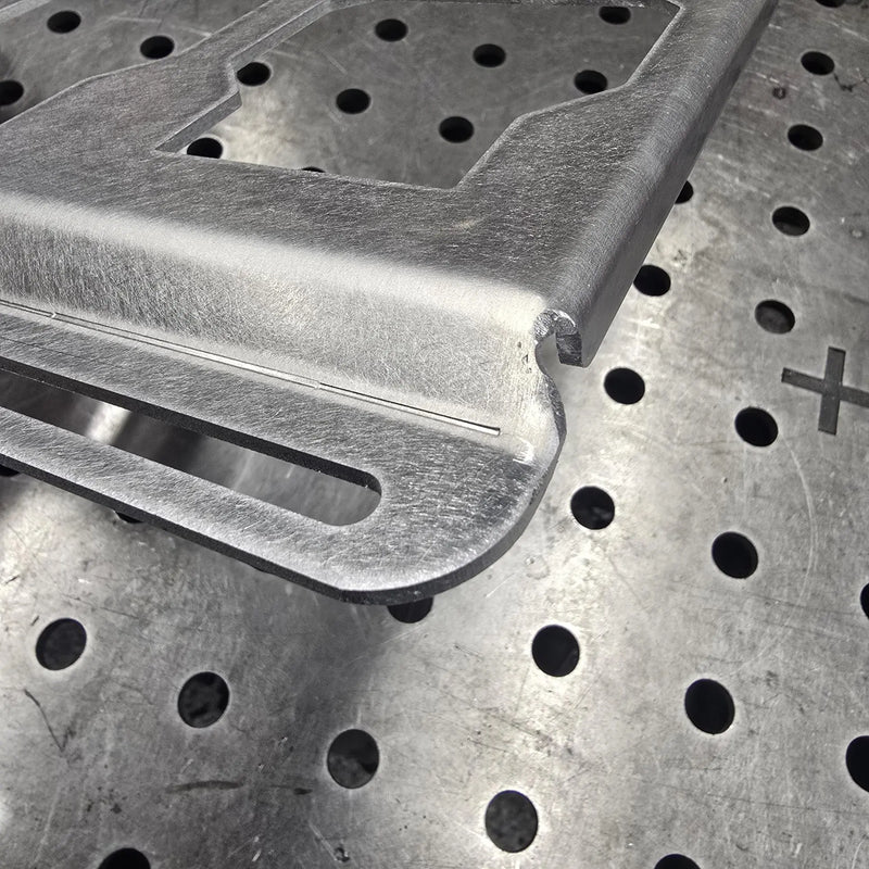 Rough cut lines near the bend on clearance aluminum top row mount