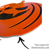 Close-up side view of an orange steel jack-o'-lantern showing the dual-layer construction that creates a 3D dimensional look and added durability.