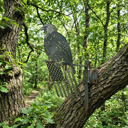 rendering of the bald eagle on flag cut from metal placed in a forest setting